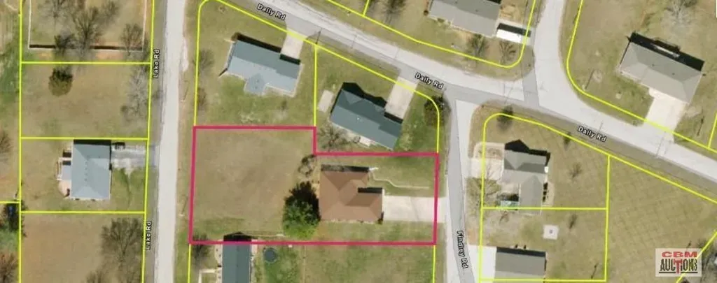 An aerial view of a residential area with a house in the middle.