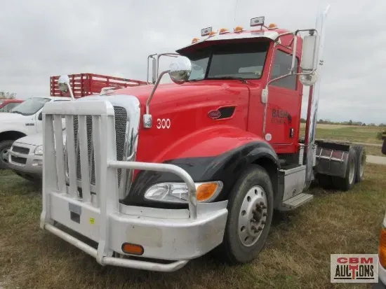 a red semi truck with the number 300 on the front