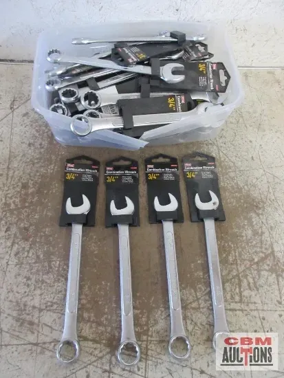 Wrenches in a plastic bin and four long wrenches in front, all with black packaging.