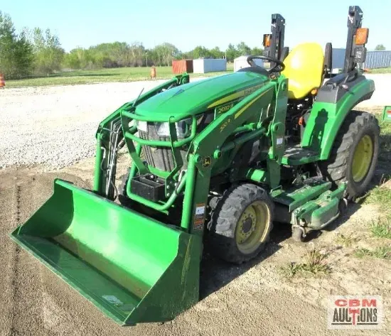 A john deere tractor with a bucket attached to it