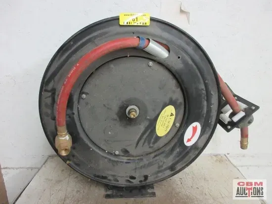 Black, round air hose reel with red hose and brass fittings. Mounted on a bracket.