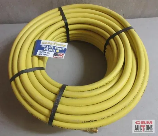 A yellow hose with a label that says cbm auctions