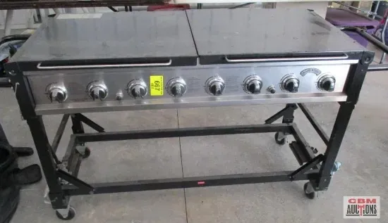 A stainless steel grill with a yellow tag on it