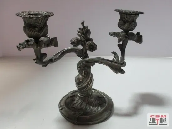 A pair of pliers and a screwdriver are on a table