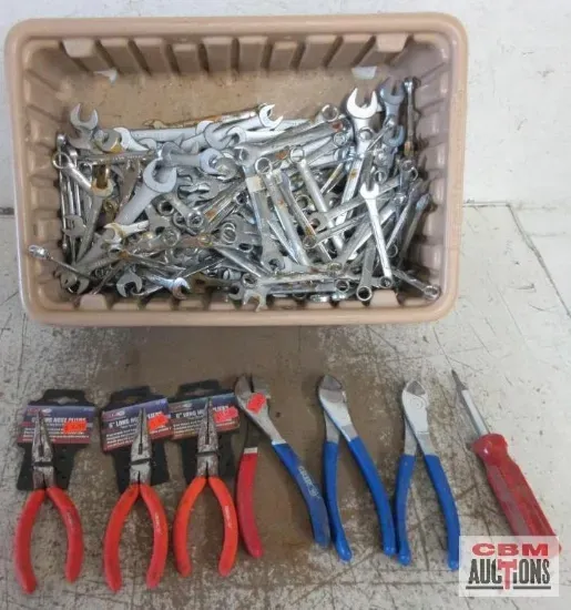 Tools in a tray and pliers with screwdrivers.