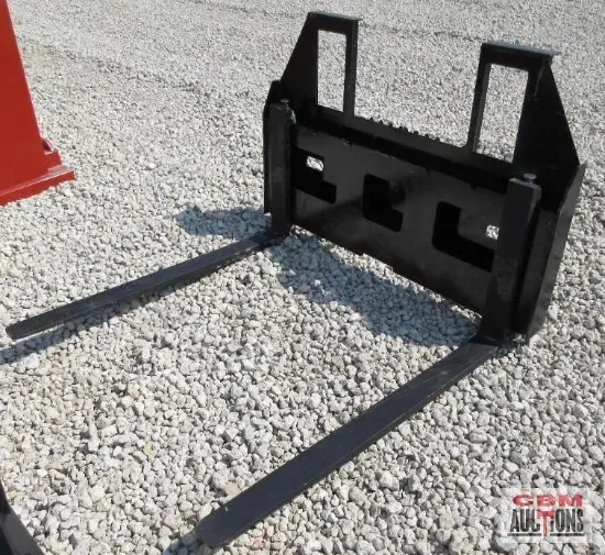 Black forklift attachment on gravel.