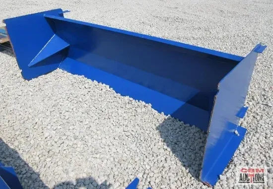 Blue metal construction bucket on gravel.