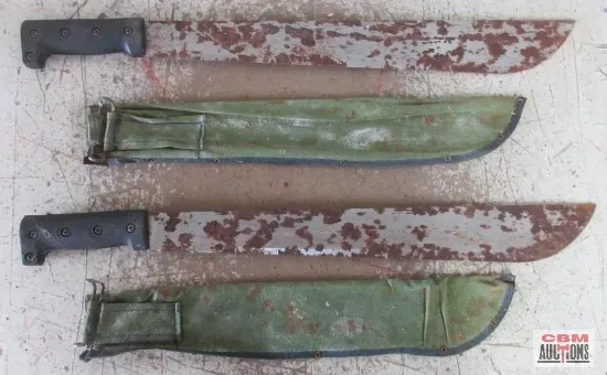 Two rusty machetes with black handles, next to their green sheaths on a table.