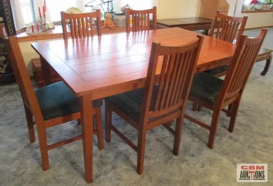 A wooden dining table and chairs in a living room