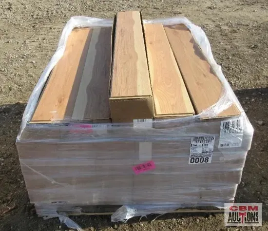 Hand axe with wooden handle and leather sheath on a textured surface.