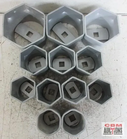 A bunch of hexagon shaped containers with cbm auctions written on the bottom