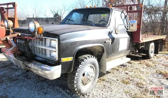 a green john deere 4250 tractor is parked in a field