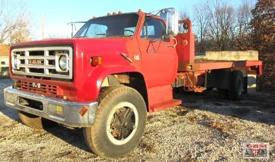 a white rv is being sold by cbm auctions