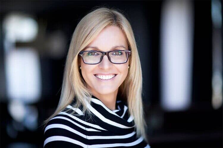 Blonde woman wearing glasses - Eye Doctor in Holiday, FL