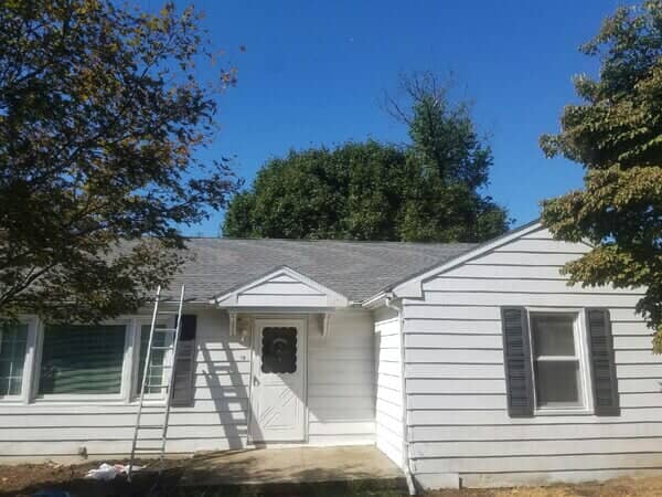 House With Ladder For Roof Repair — York, PA — Dallastown Roofing & Contracting