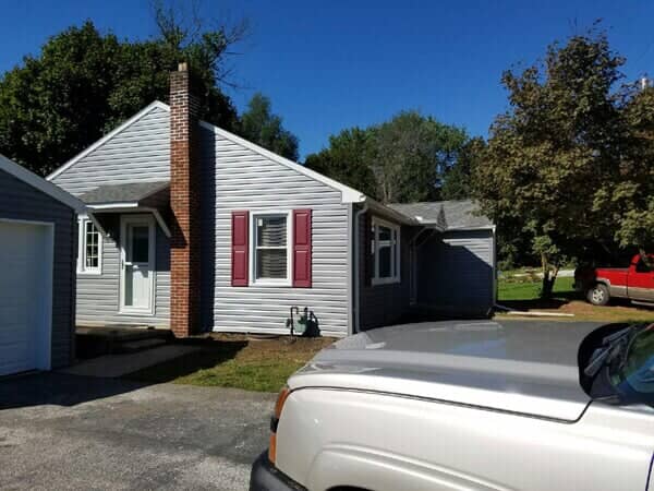 New Grey Siding Of House With Chimney — York, PA — Dallastown Roofing & Contracting