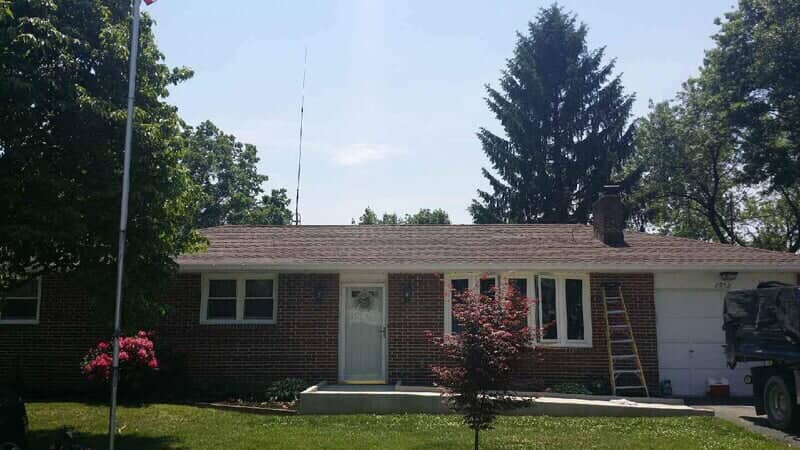 Brick House With Newly Installed Roofing — York, PA — Dallastown Roofing & Contracting