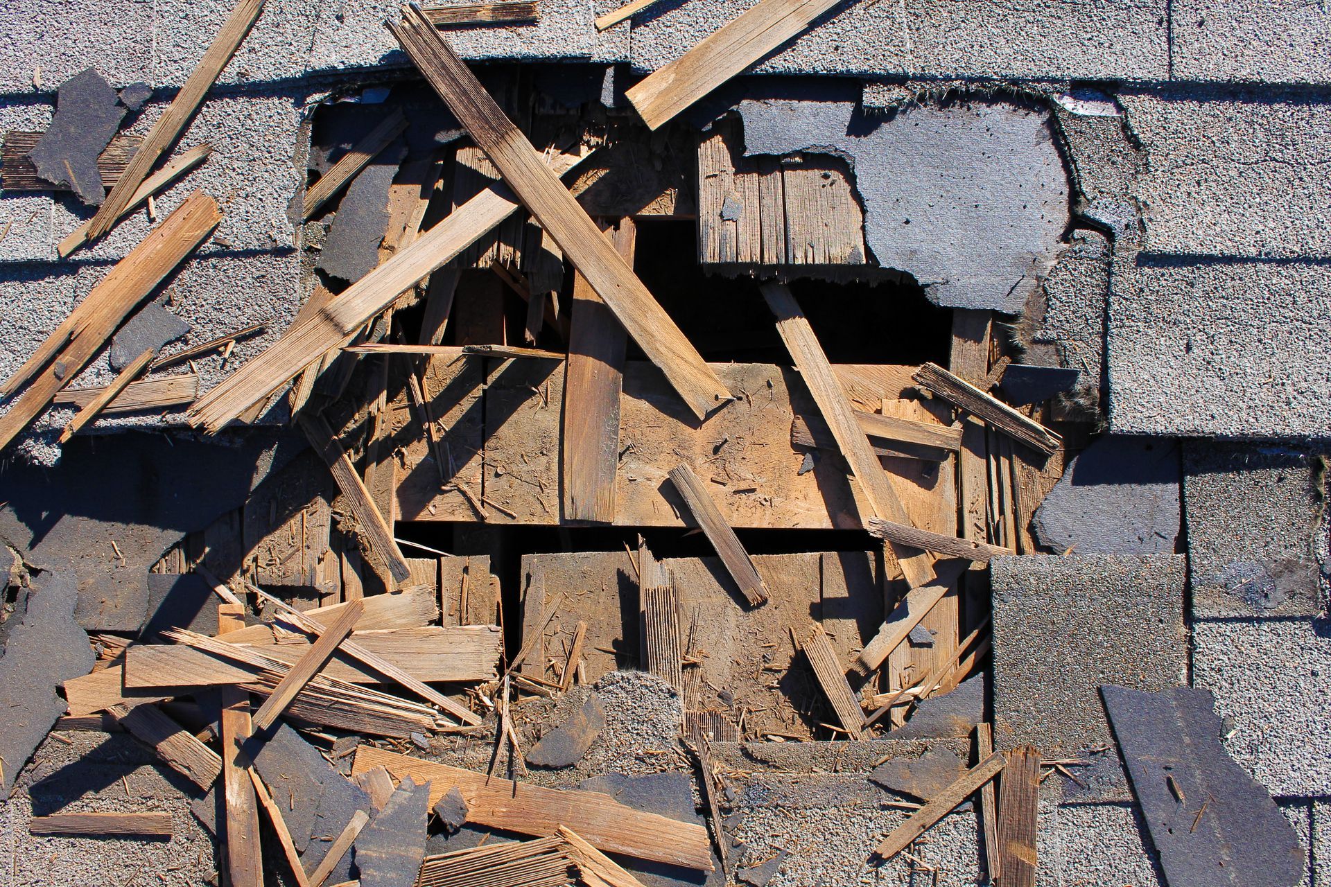 Aged shingles needing roof replacement