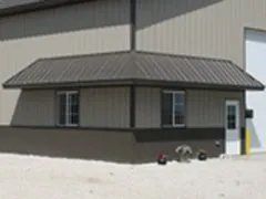 Pole barn with wrap around lower roof