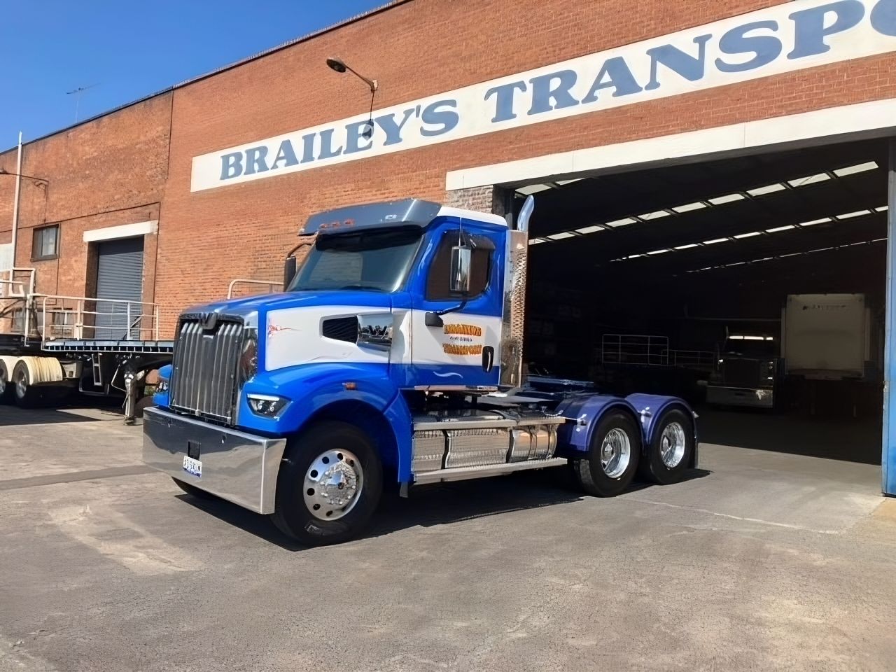 Braileys Transport truck outside shed