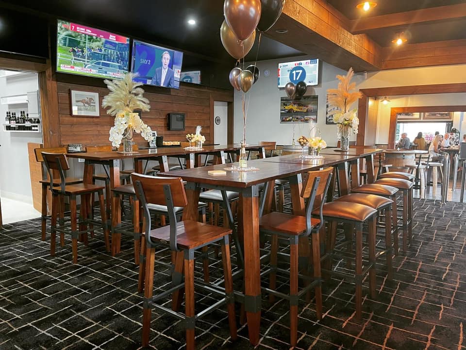 A Restaurant With Tables And Chairs And Balloons On The Ceiling — Original North Australian in Bowen, QLD