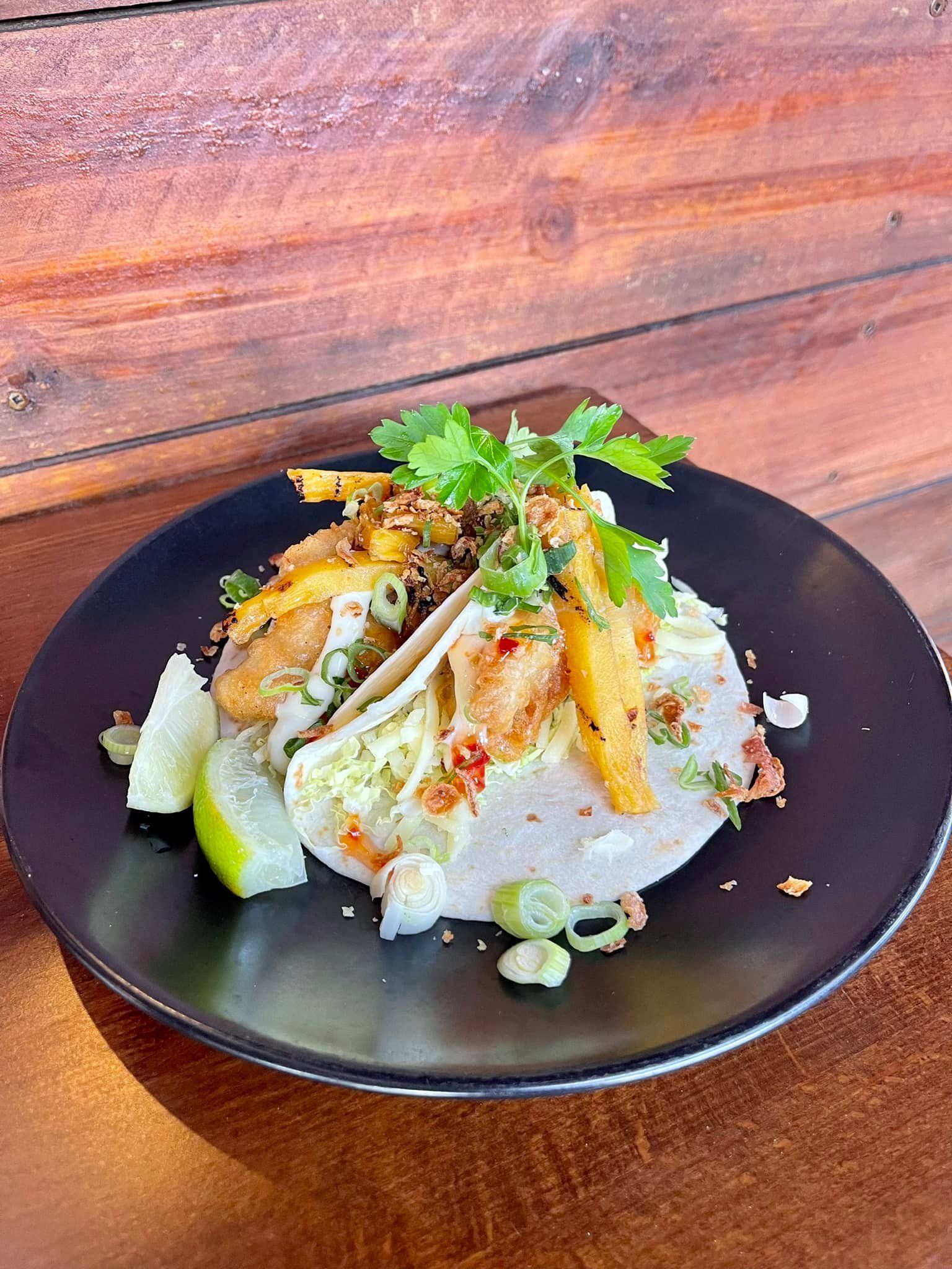 A Close Up Of A Plate Of Food On A Wooden Table — Original North Australian in Bowen, QLD