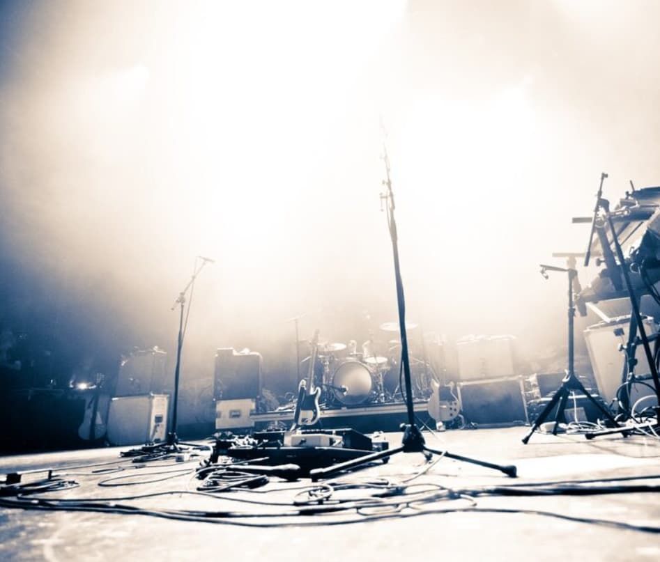 A Black And White Photo Of A Stage With A Band On It — Original North Australian in Bowen, QLD