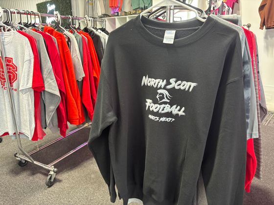 A store filled with lots of clothes hanging on racks.