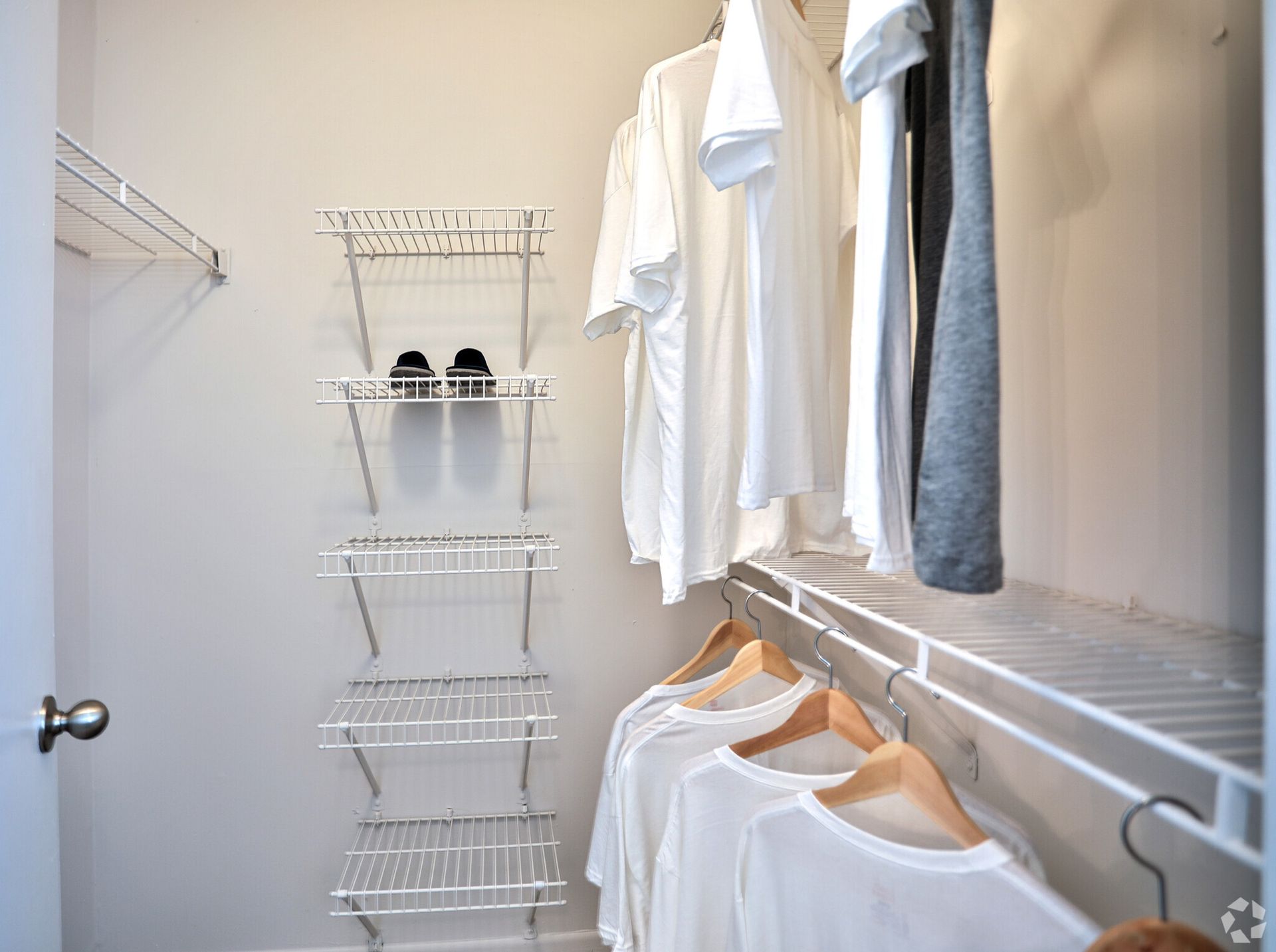 A walk in closet filled with clothes and shoes at The Summit at Rock Hill in Rock Hill, SC.