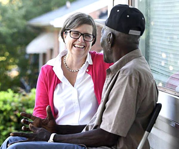 Dr. Beth Mulberry and a patient on his front porch