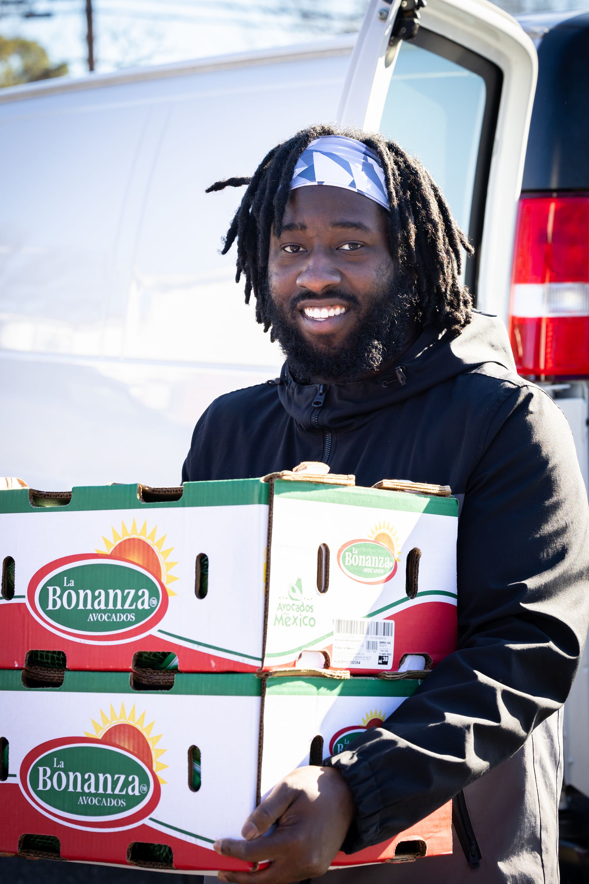Volunteers help distribute food during our pop-up market