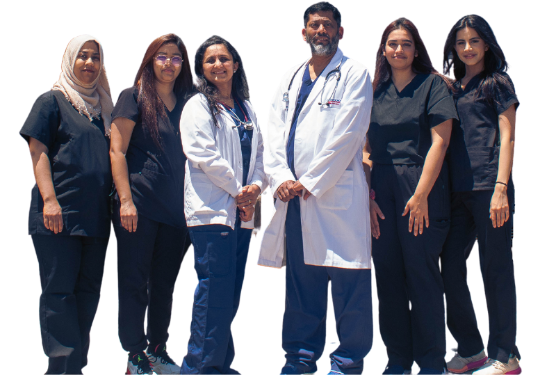 a group of doctors and nurses are posing for a picture .