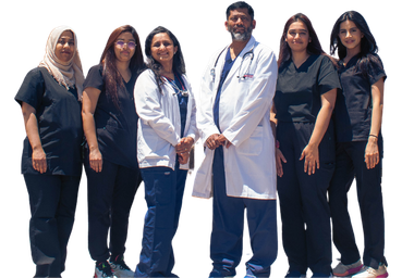 a group of doctors and nurses are posing for a picture .