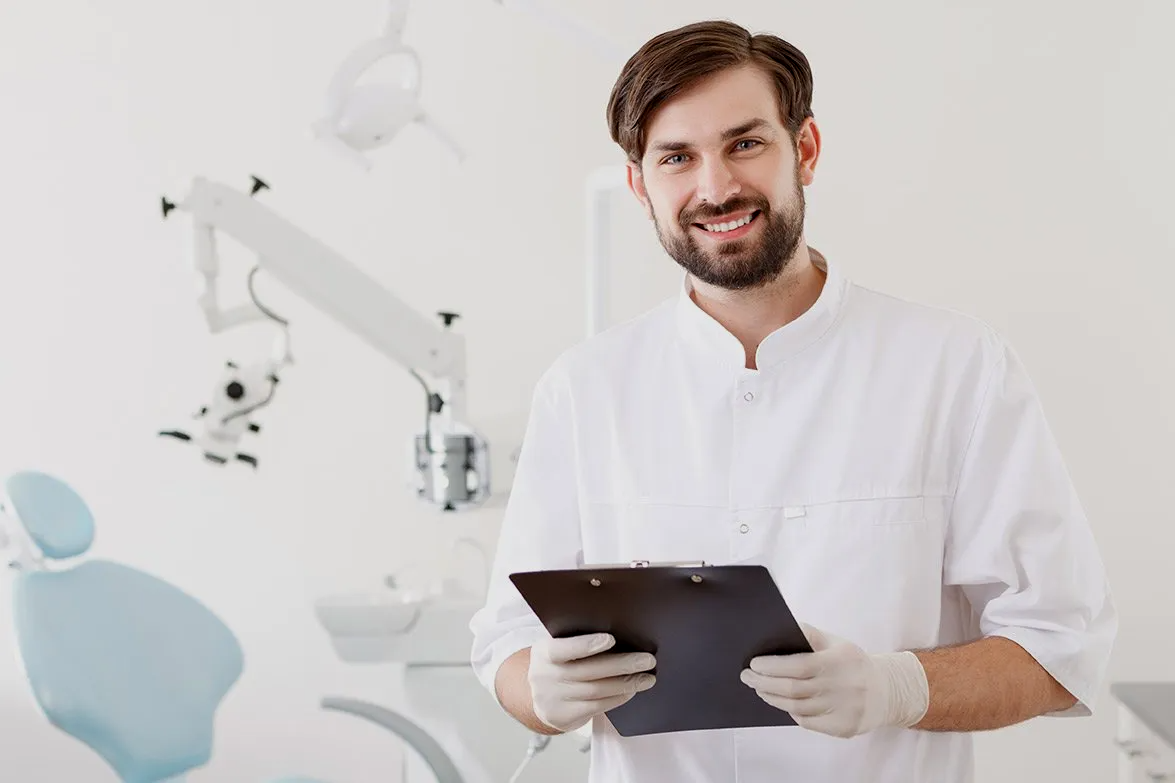 a doctor is holding a clipboard in a medical office .