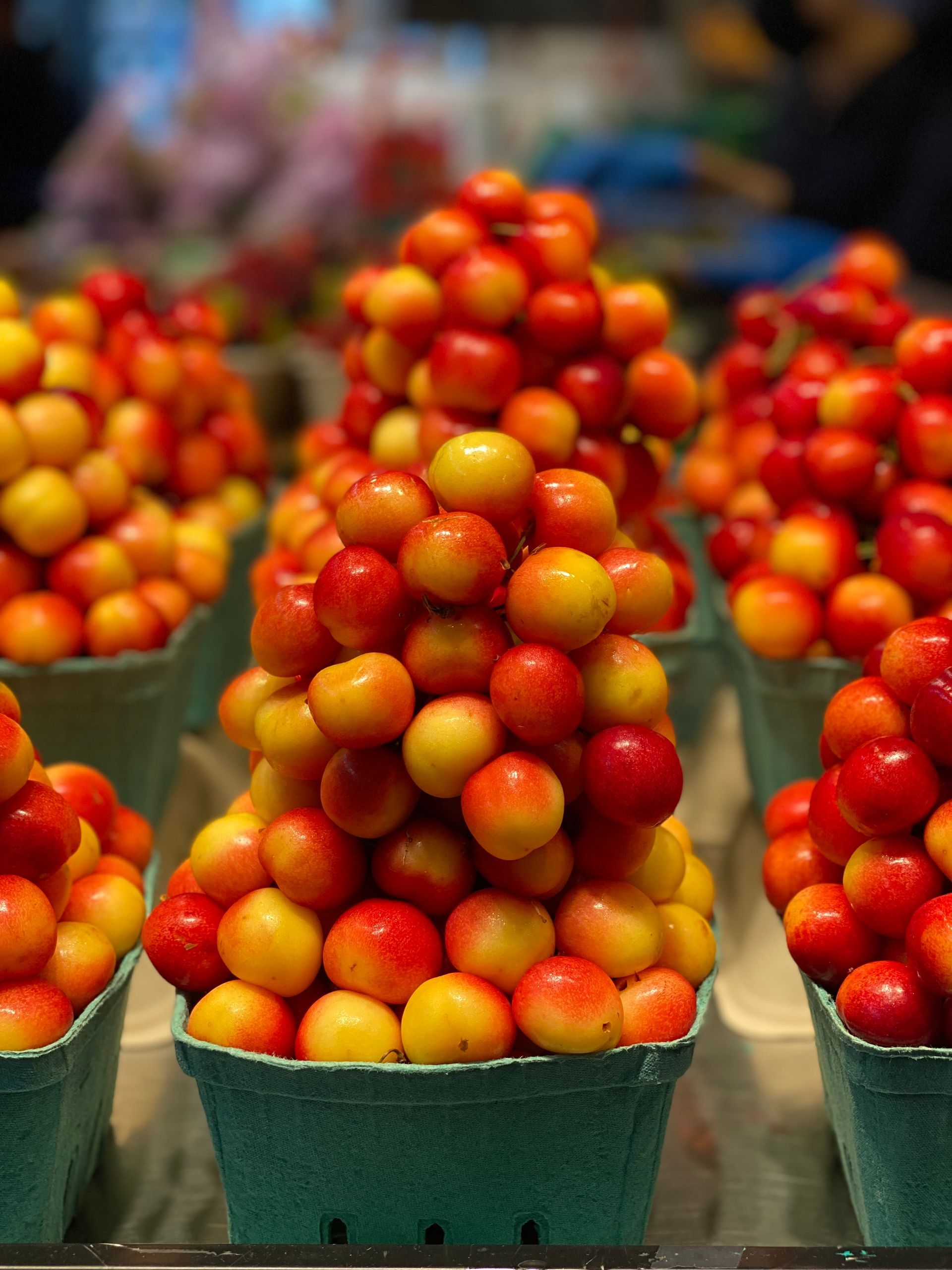 A bunch of cherries are stacked on top of each other
