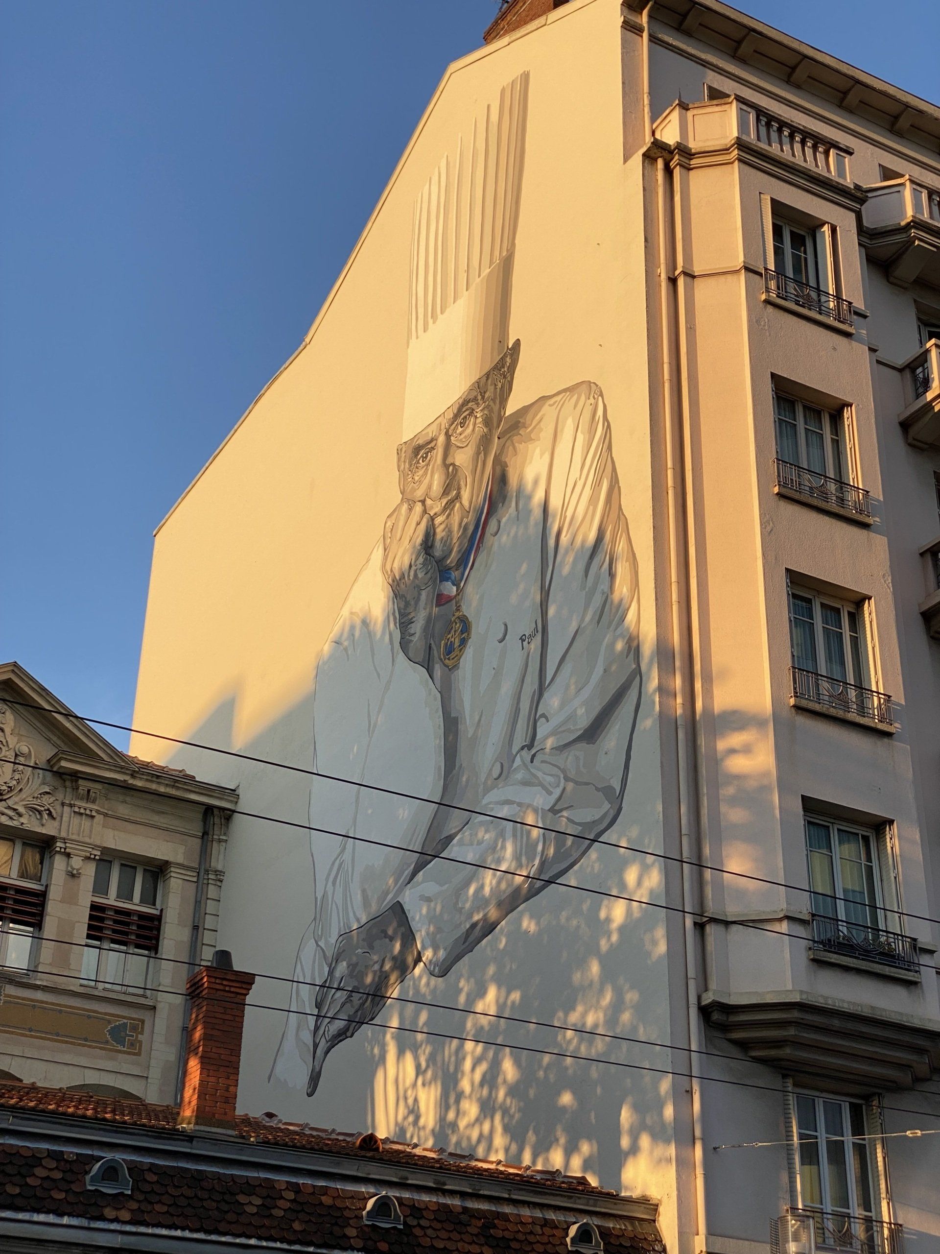 A large painting of a man on the side of a building