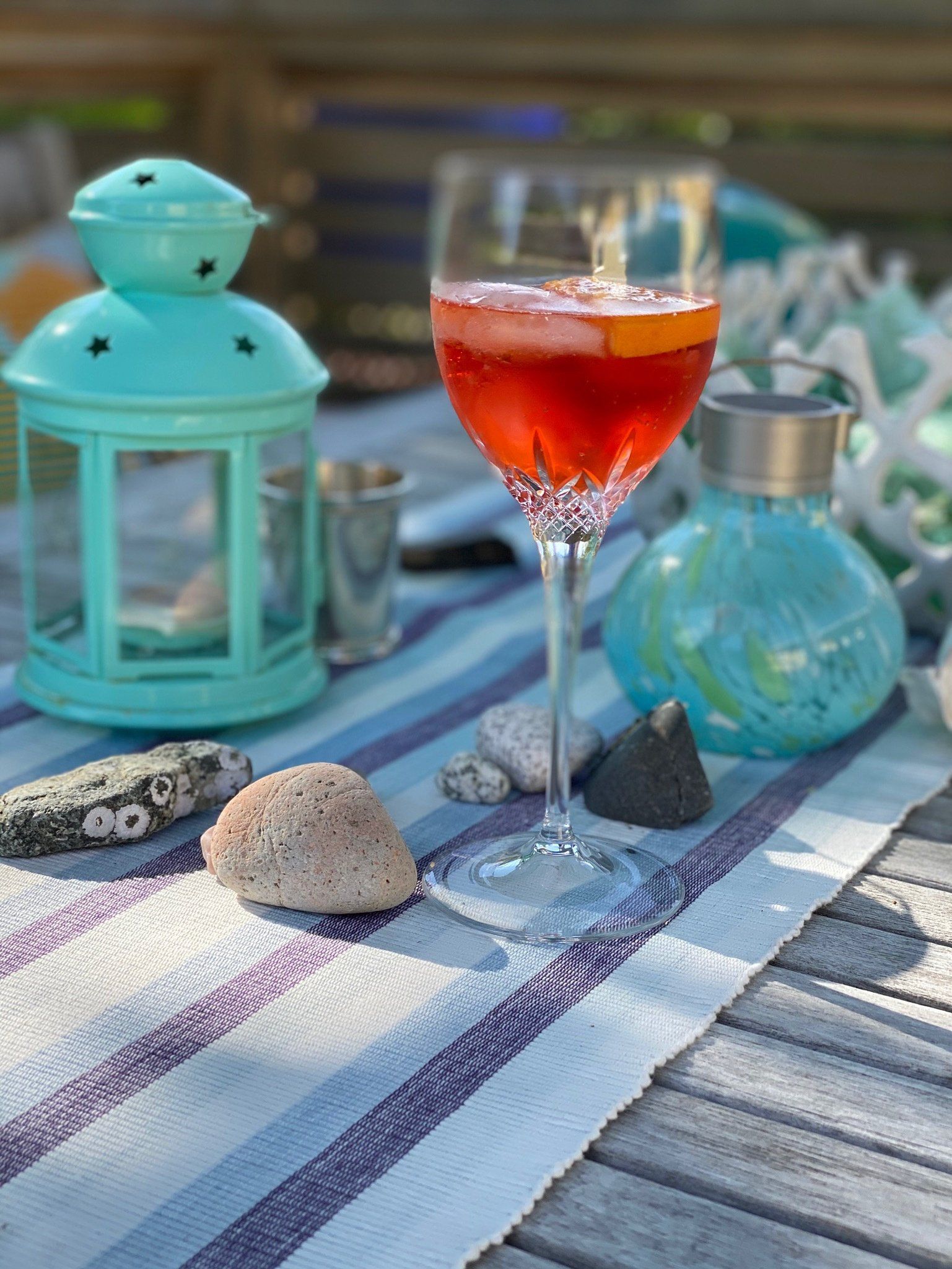 A glass of red wine is sitting on a table