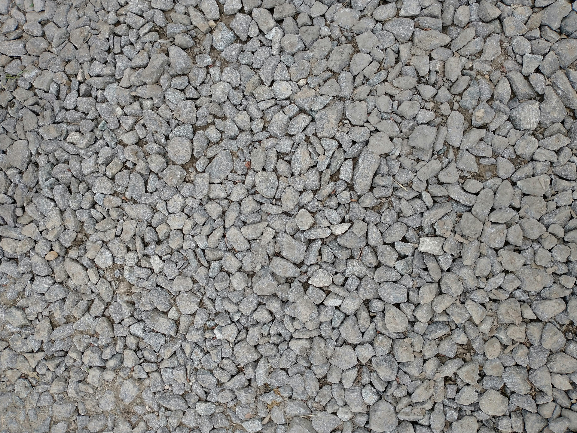 Pile of small gray gravel stones filling the frame