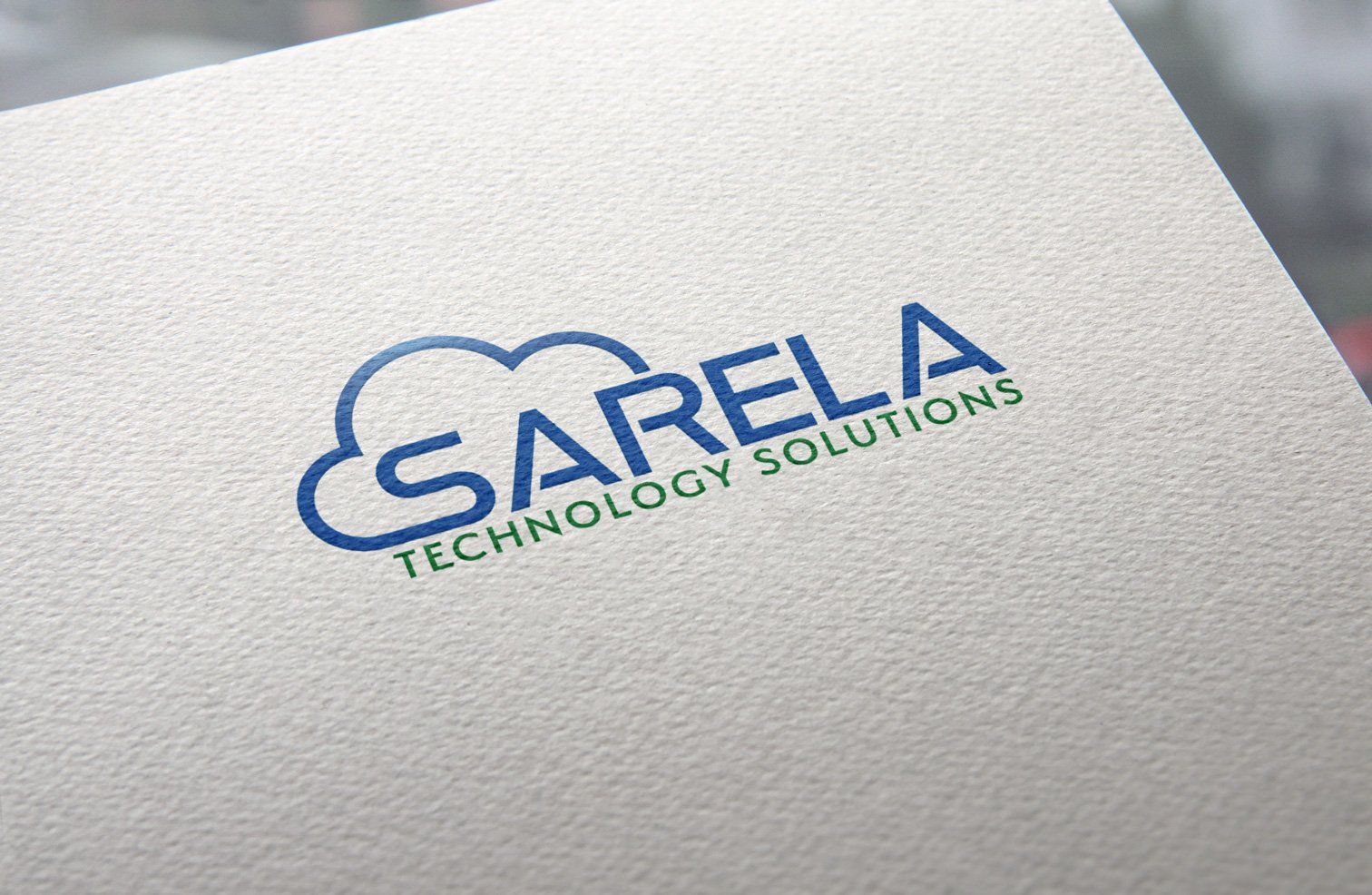 The logo for sarela technology solutions is on a piece of paper.