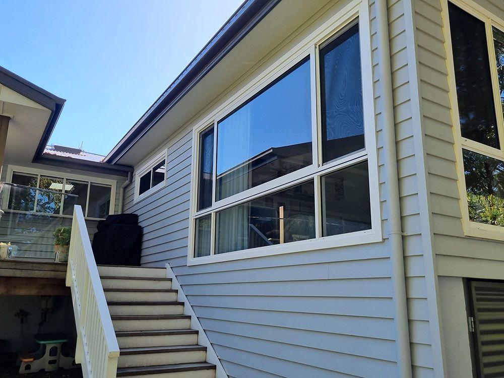 A House With Stairs With Sliding Glass Window — Jervis Bay Pressure Washing & Property Maintenance in Sanctuary Point, NSW