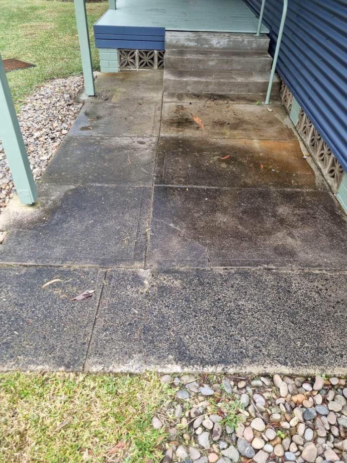 A Dirty Sidewalk Next To A House With Steps — Jervis Bay Pressure Washing & Property Maintenance In Bowral, NSW