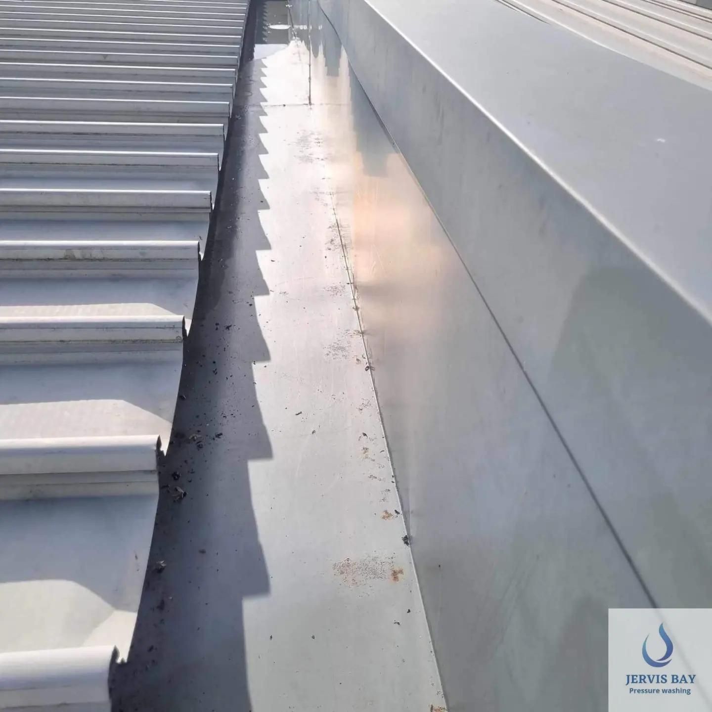 A Roof Gutter Is Cleaned — Jervis Bay Pressure Washing & Property Maintenance In Culburra, NSW