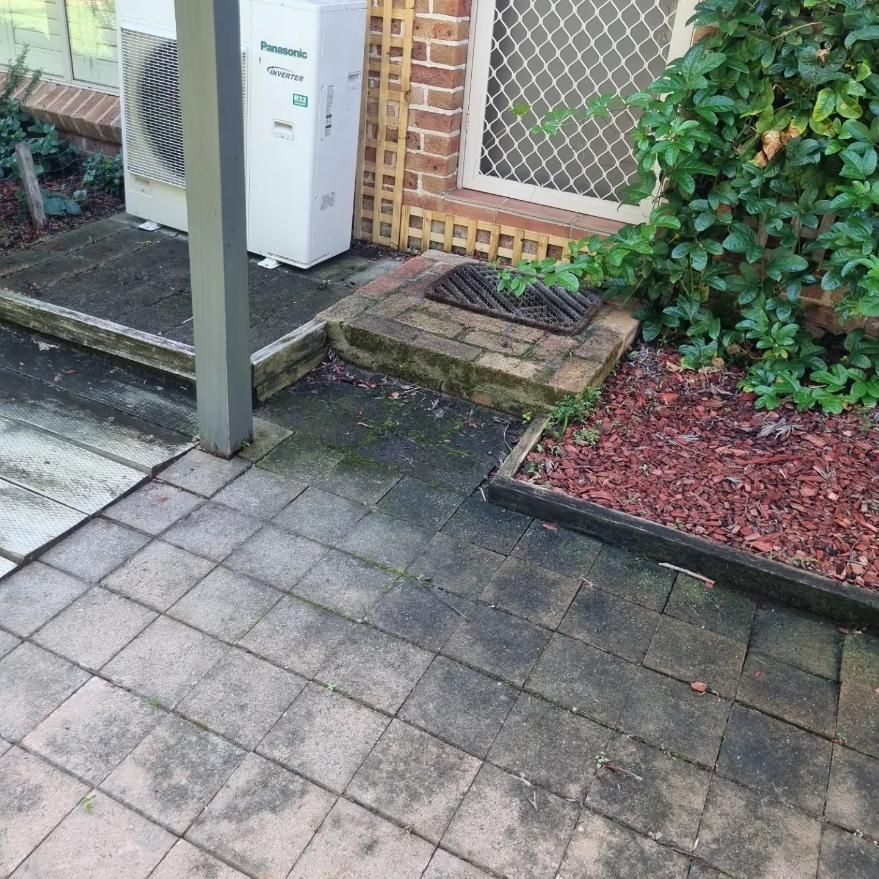 A Dirty Patio With A Panasonic Air Conditioner — Jervis Bay Pressure Washing & Property Maintenance In Sanctuary Point, NSW