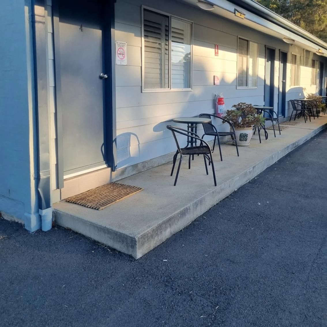 A Patio Area With Tables And Chairs — Jervis Bay Pressure Washing & Property Maintenance In Berry, NSW