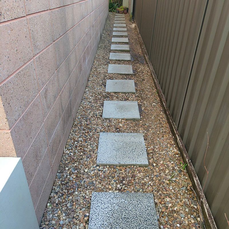 A Walkway With Concrete Stepping Stones Is Cleaned — Jervis Bay Pressure Washing & Property Maintenance in Sussex Inlet, NSW