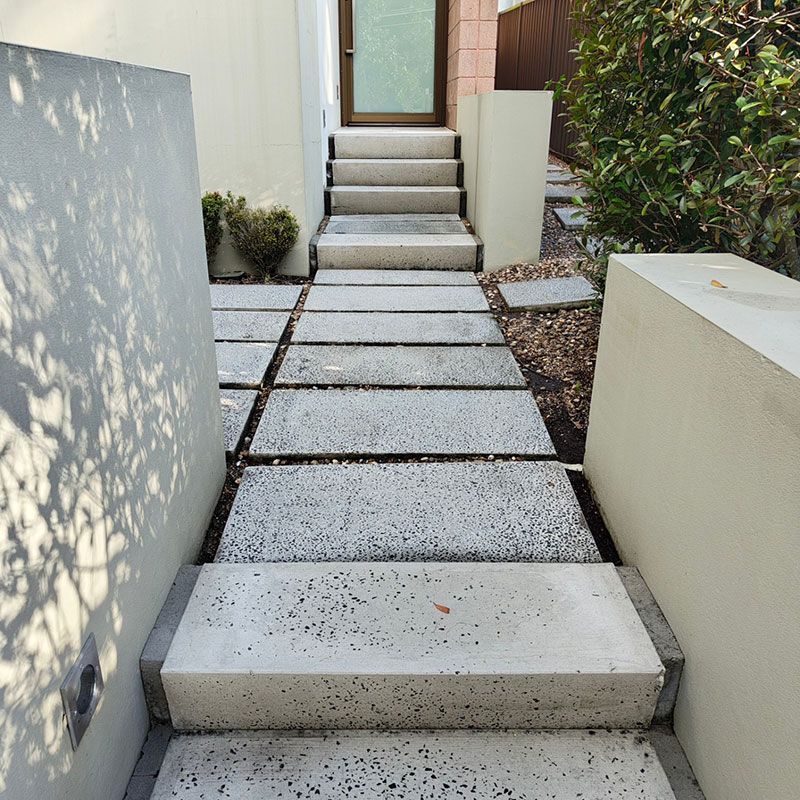 A Concrete Walkway With Stairs After Cleaning — Jervis Bay Pressure Washing & Property Maintenance in Vincentia, NSW