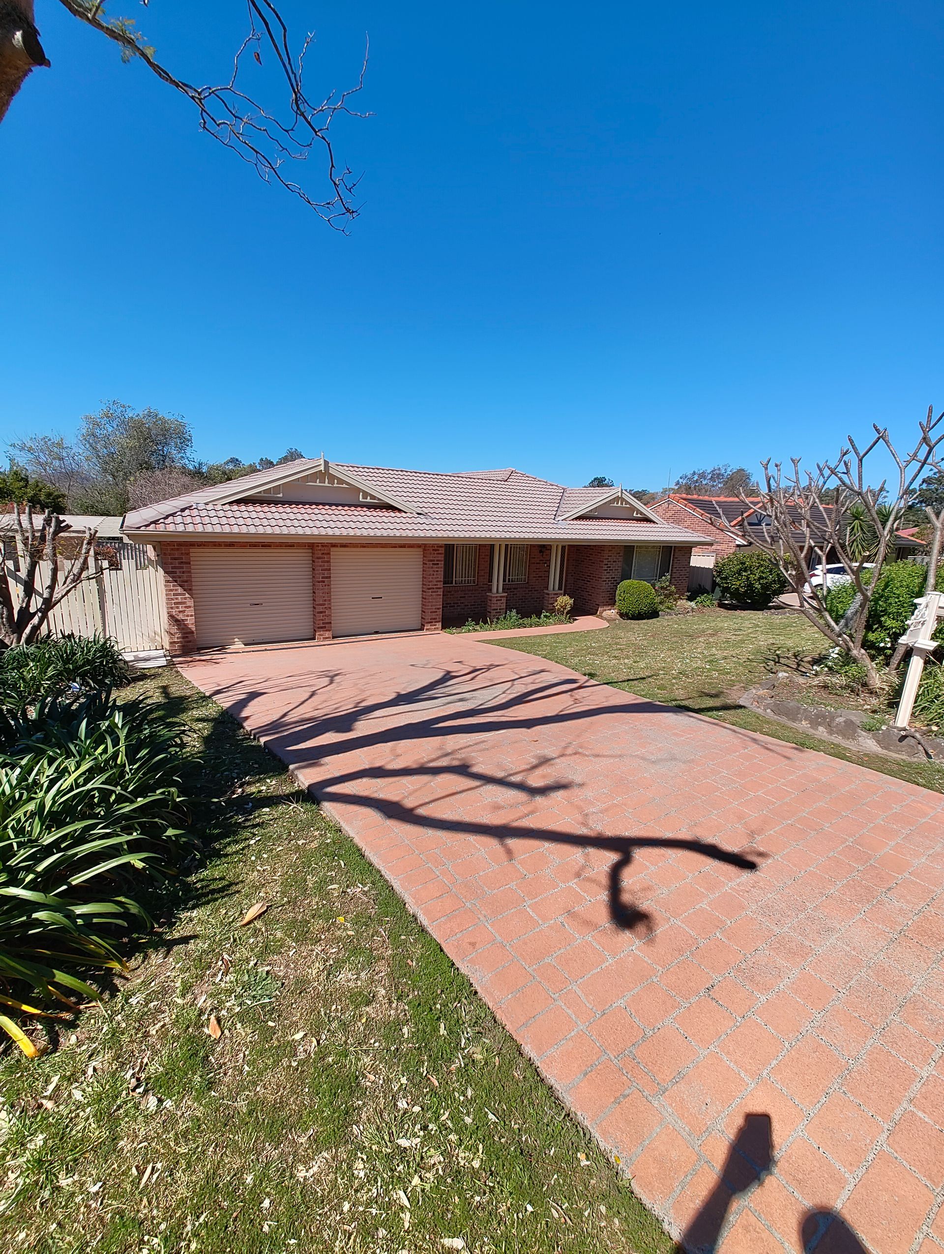 A Cleaned Brick Driveway Leading To A House — Jervis Bay Pressure Washing & Property Maintenance in Sanctuary Point, NSW
