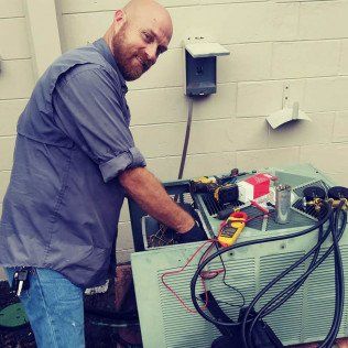 Man Doing Aircon Maintenance — Lithia, Fl — JS Watson Air