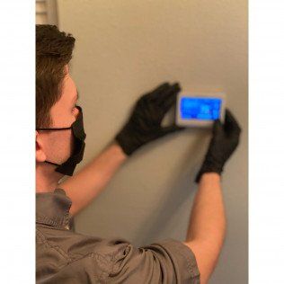 Man Setting AC Gadget — Lithia, Fl — JS Watson Air