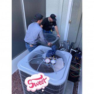 Two Man Holding Big Aircon — Lithia, Fl — JS Watson Air